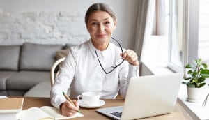 4-Ways-to-Advance-Your-Written-Communication-Skills-When-Working-from-Home professional woman writing