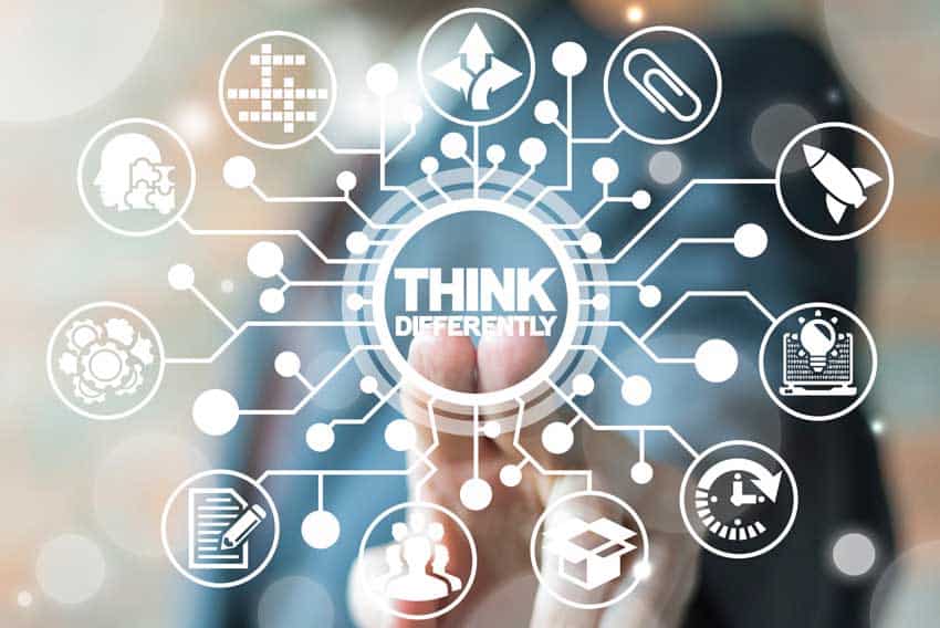 Graphic: "Think differently" in a circle with many nodes and connections around it, including the symbols: Paperclip, Rocket, Laptop with a lightbulb in front of it, clock, open cardboard box, group of people, pen and paper, cogwheels, jigsaw puzzle, crossword puzzle, arrows in three directions