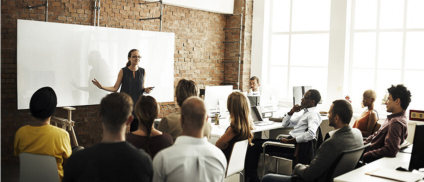 woman leading corporate training session