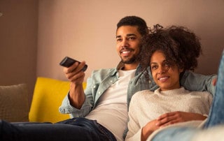 young couple watching tv