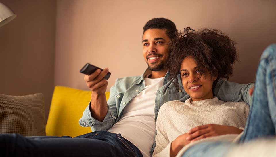 young couple watching tv